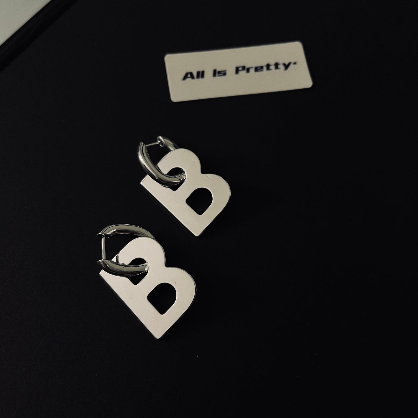 “B” earrings